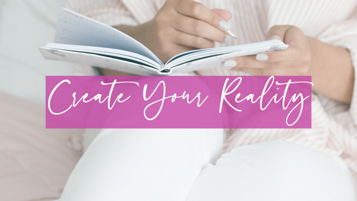 woman journaling with "Create Your Reality" written across her lap